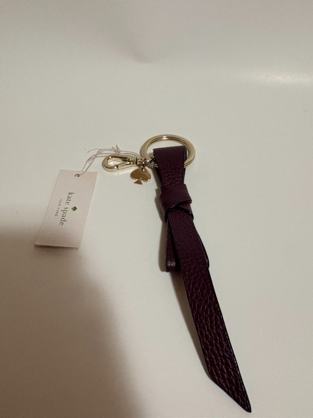 Kate Spade New York NWT Deep Plum Leather Knot Keychain Bag Charm Gold